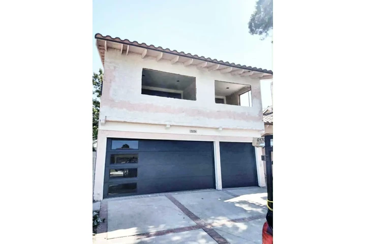 Vertical glass garage doors image 1