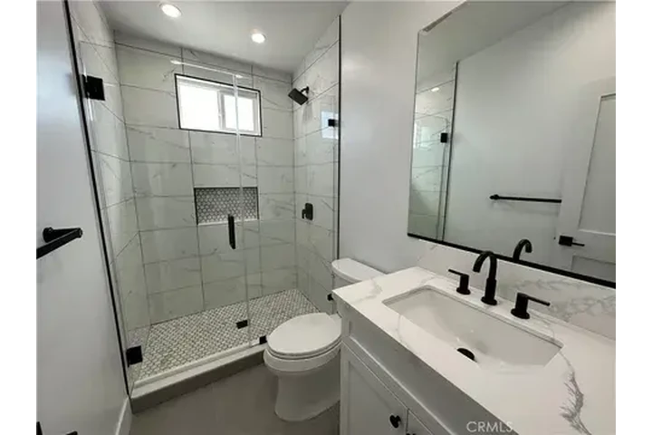 $1000 : This home boasts two spacious image 2