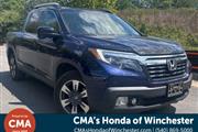 PRE-OWNED 2017 HONDA RIDGELIN