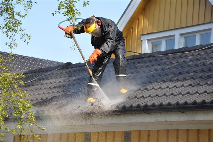 Cleaning gutters image 4