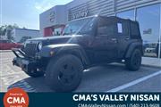 PRE-OWNED 2015 JEEP WRANGLER en Madison WV