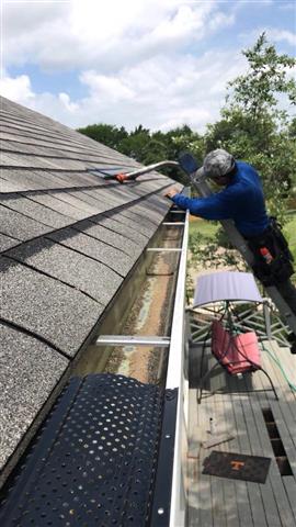 Cleaning gutters image 5