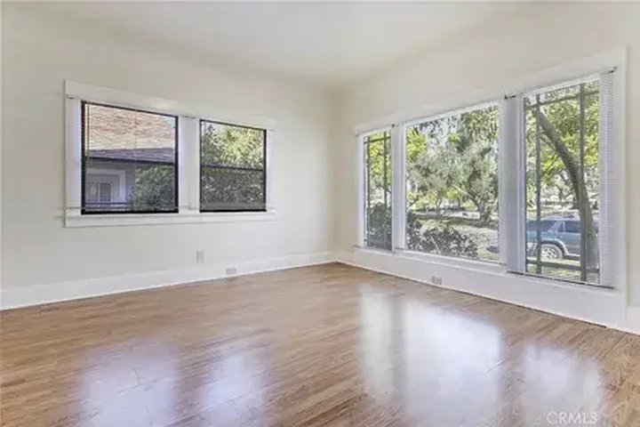 $1000 : This home boasts two spacious image 2